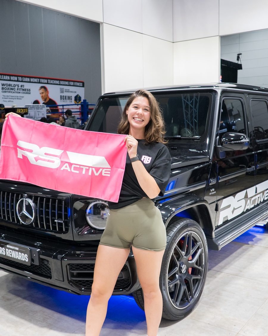 Member with an RS Active flag in front of the Mercedes AMG G63
